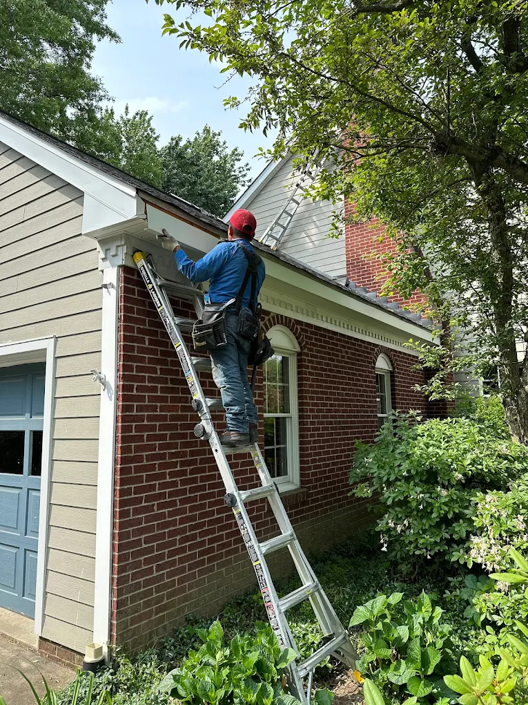 A house with a new roof in a residential neighborhood.